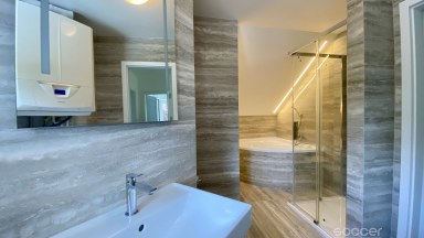Příjemný dům po celkové modernizaci se zahradou v prestižní lokalitě.