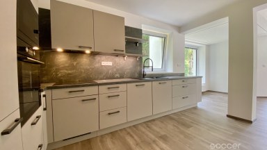 Příjemný dům po celkové modernizaci se zahradou v prestižní lokalitě.
