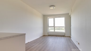 Pronájem nového bytu 2+kk s balkonem a garáží na Praze 9.